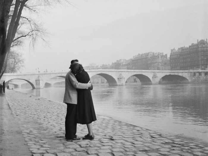 In this photo, a couple is seen embracing on the bank of Seine in the 1950s.