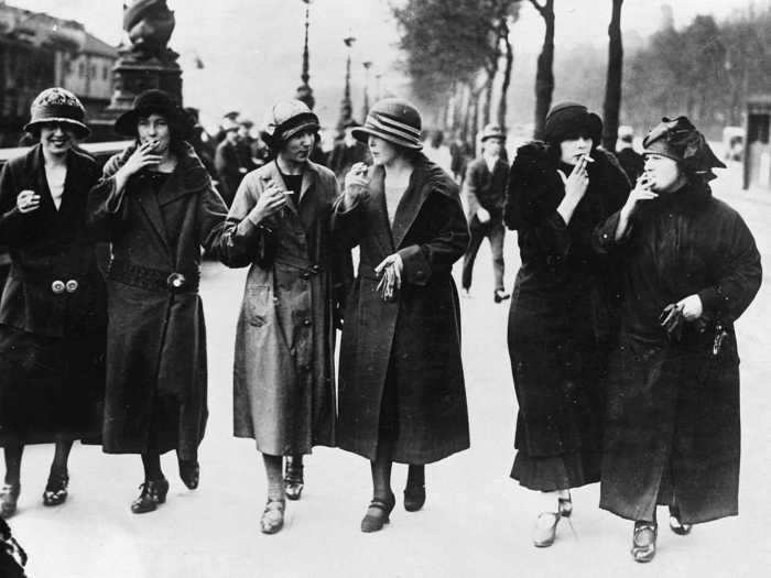 Fashion became a defining point of Parisian culture. In this photo, women from Germany are seen wearing Parisian style-clothing and smoking cigarettes to fit in circa 1925.