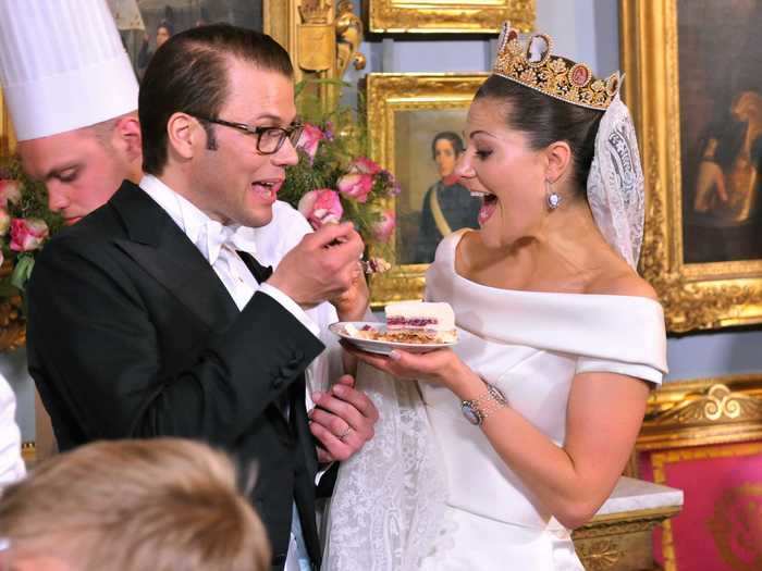 Prince Daniel, Duke of Vastergotland and Princess Victoria of Sweden shared a piece of wedding cake in Stockholm, Sweden, in 2010.