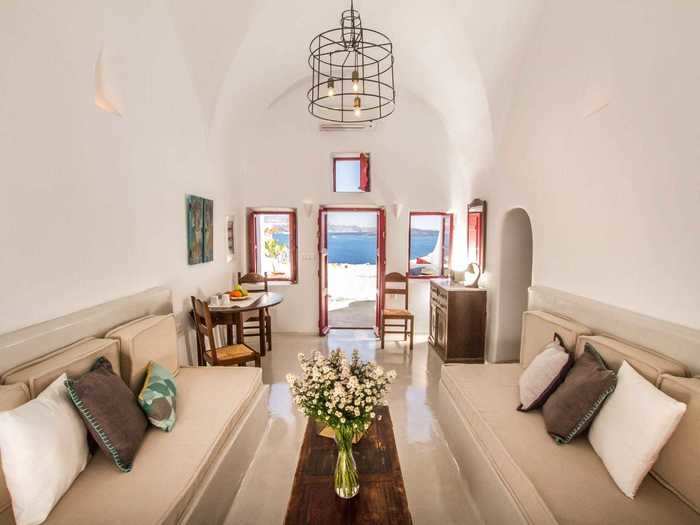 A stay at the Hector Cave House, a former wine cellar carved into a caldera, comes with breathtaking views of Santorini and an outdoor plunge pool.