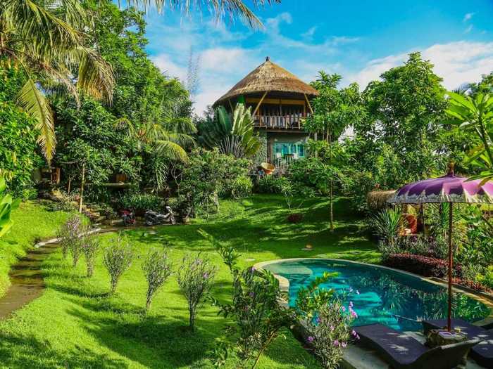 This one-bedroom Bali treehouse is minutes from the beach and features its own pool and lush garden.