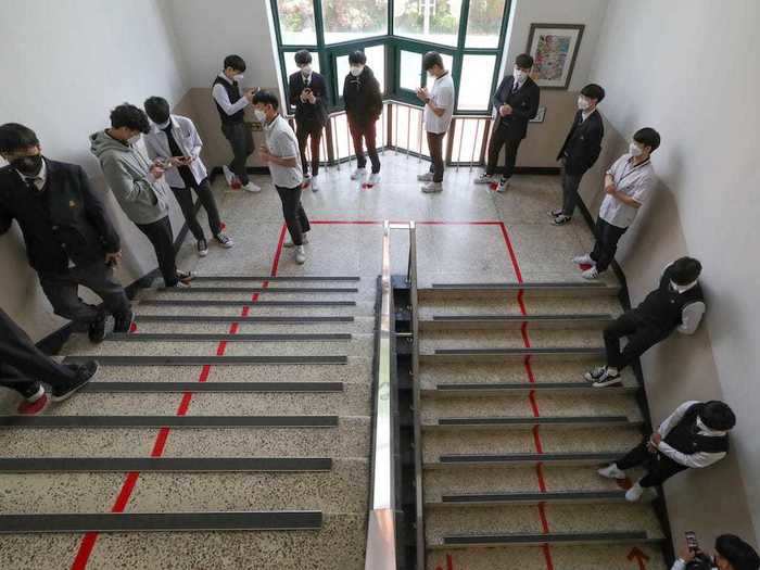 These students in Seoul have to line up with at least two steps between them. As students were reunited, some put their arms around their friends