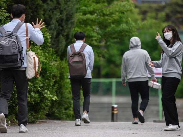 All school staff members and students now have to wear masks, as well as maintain social distancing measures on campus.