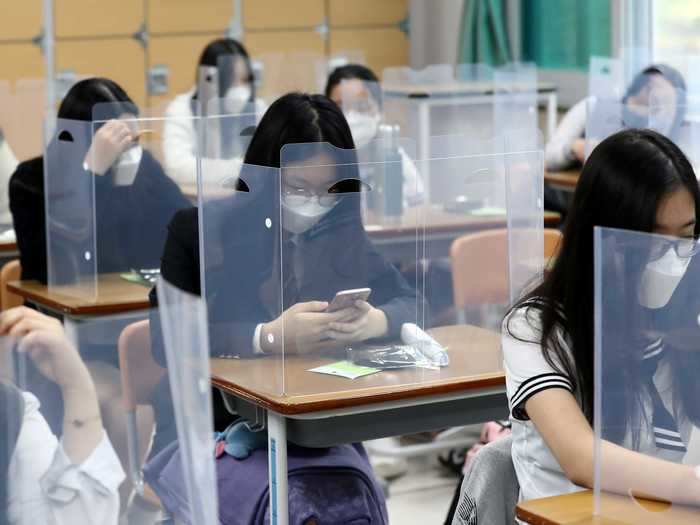 Some schools have also put transparent partitions on desks in classrooms.