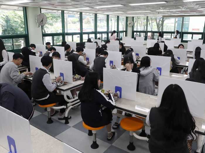 ... while this school in Ulsan used opaque dividers, and sat with space in between them.