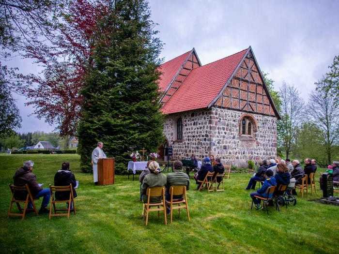 This church in Mecklenburg-Western Pomerania moved service outside in order to keep devotees physically apart.