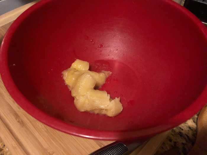 After letting the bananas, which were frozen, defrost at room temperature, I cut them open and placed the goopy insides in a large bowl.