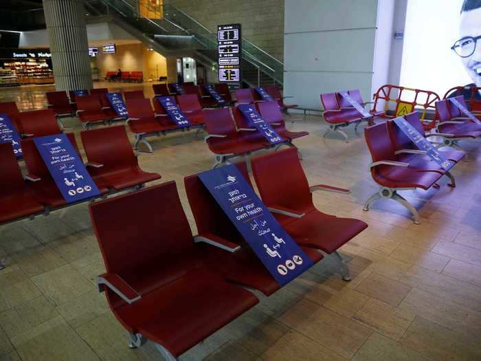 While passengers wait to board the plane, many airports have created social distancing guidelines in terminals so people can be spaced apart from one another.