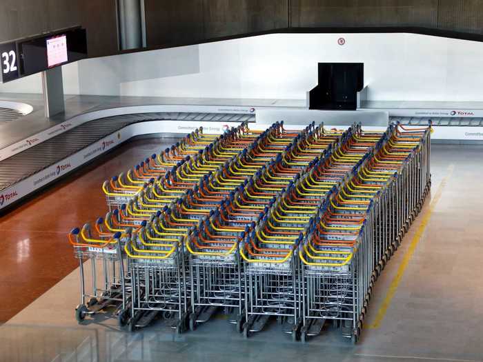 The International Air Transport Association has previously warned that European airlines could see demand drop 55% this year. Here, empty luggage carts are seen in France, where travel restrictions have been strict.