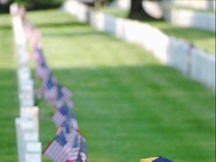 Boy scouts in Kentucky have been placing American flags at Zachary Taylor National Cemetery on Memorial Day weekend for decades, like this boy in 1997.