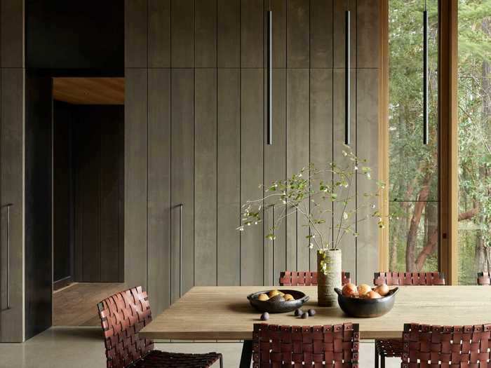 The interior design blends materials and textures like weathered wood ...