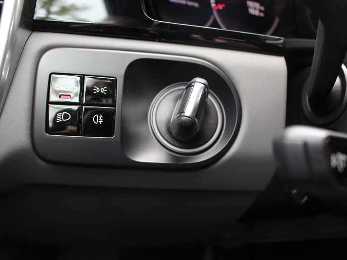 Nods to Porsche tradition include the starter switch, left-hand mounted ...