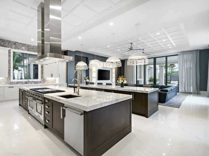 The airy kitchen features state-of-the-art appliances. The neutral color scheme seen in the kitchen is adhered to throughout the home