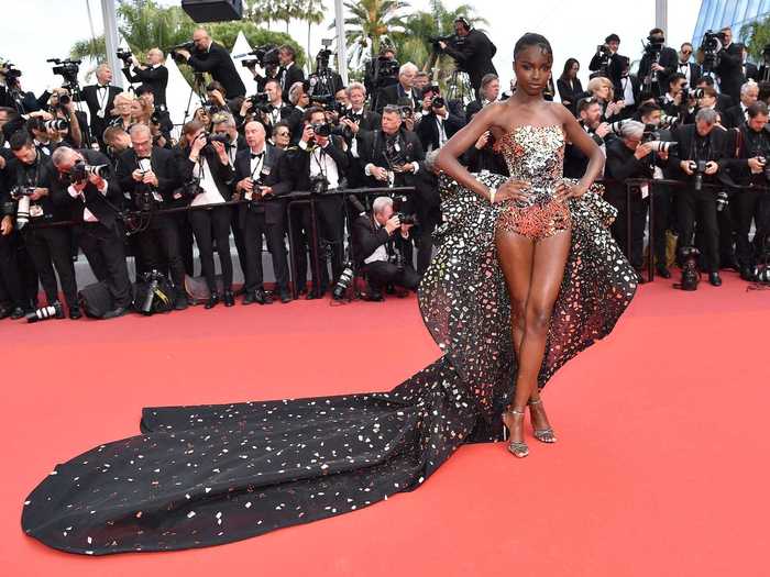 Leomie Anderson sparkled in gold-flecked shorts at the "Once Upon A Time In Hollywood" screening.