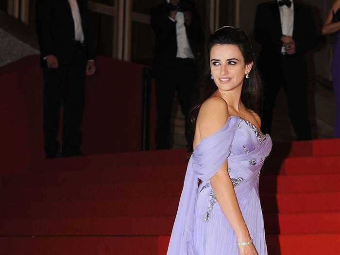 Penelope Cruz arrived at the 2009 festival wearing a purple dress with draped sleeves.