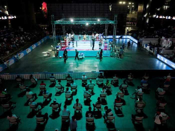 Some sporting events have allowed spectators, like Bufalo boxing in Nicaragua, where fans practice social distancing.