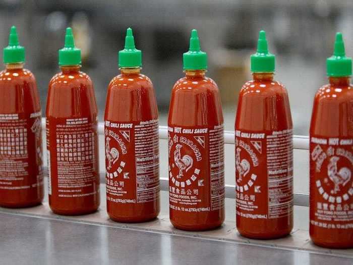 Hot sauce usually has enough vinegar to keep it fresh without you having to leave it in the fridge.