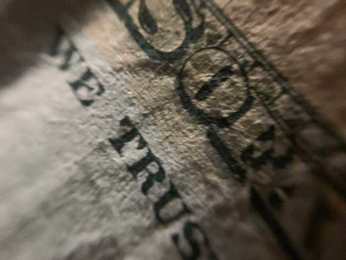 Using a smart phone attachment, I started taking miniature photography to create images like this photo of a dollar bill.