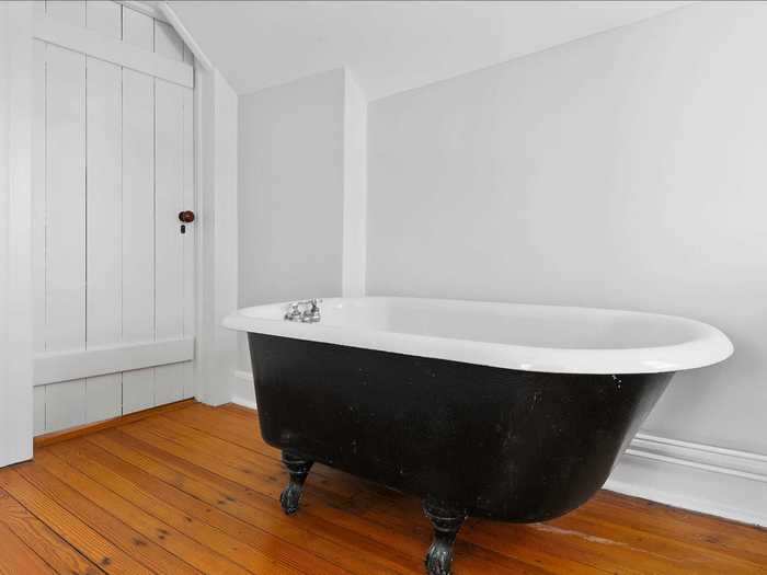 ... and four bathrooms, one of which features this clawfoot bathtub.