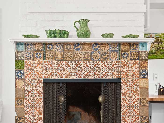 The home also contains playful details, like this tiled fireplace ...