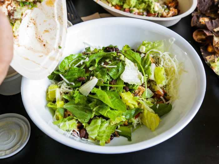 Finally, I moved onto the salad. I dumped my bowl in a bigger bowl, as per the TikTok instructional.