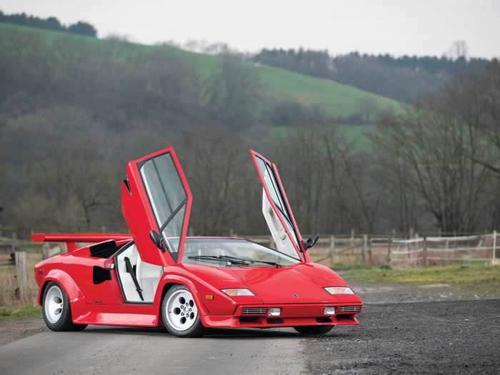 This red one has fewer than 9,000 miles on the clock.