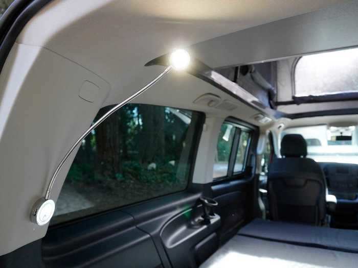 Six of these charging ports are placed under the three reading lights, two of which are on the "lower level" of the van.