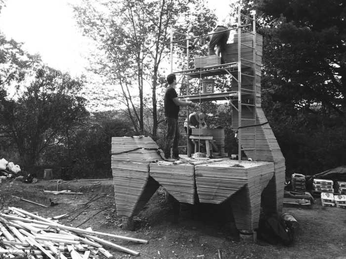 3D printed concrete legs elevate the cabin to adjust to a sloped landscape.