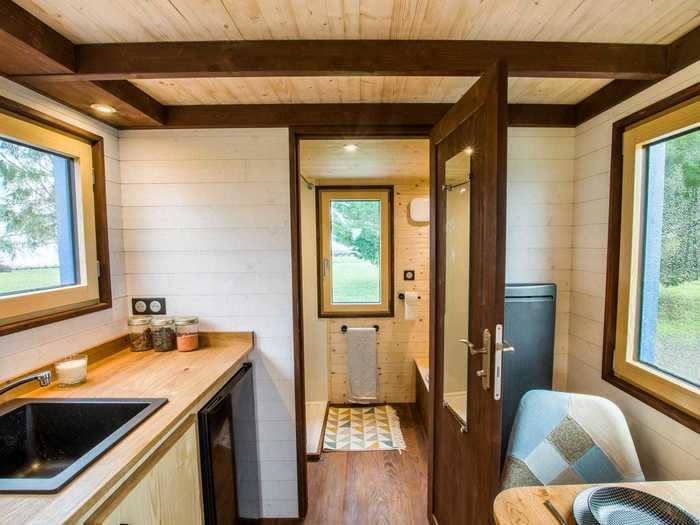 The bathroom sits at the opposite end of the tiny home.