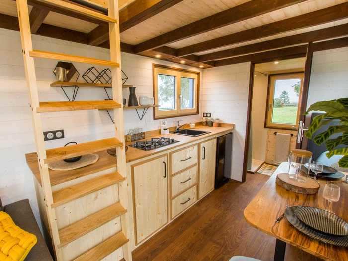 … which is adorned with spruce and oak countertops, drawers, and shelves.