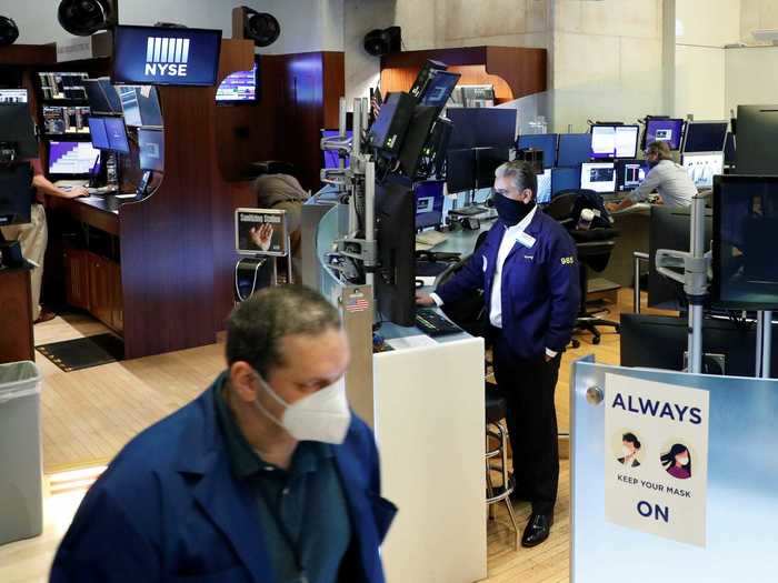 The environment of the New York Stock Exchange is taking on a new atmosphere as traders are required to wear masks and signs posted around the building indicate they must be worn at all times.