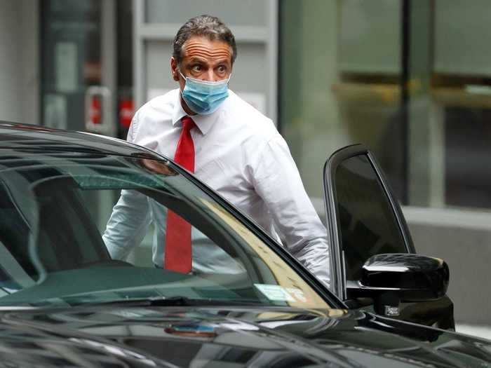 New York Gov. Andrew Cuomo arrived at the New York Stock Exchange Tuesday wearing a protective face mask to ring the opening bell.