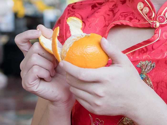 Turn orange peels into candy and syrup.