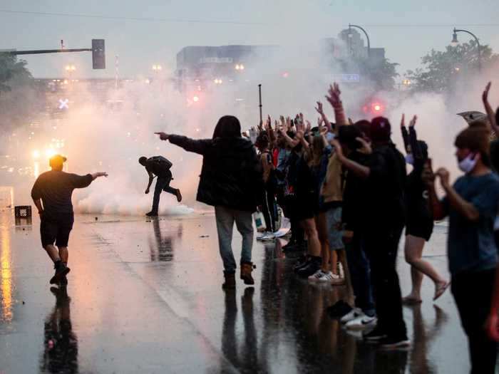 In the early evening, police began firing tear gas and flash grenades at the crowds.