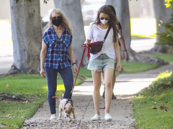 Lily Collins and her mom, Jill Tavelman, covered up for a walk with her cute pup.