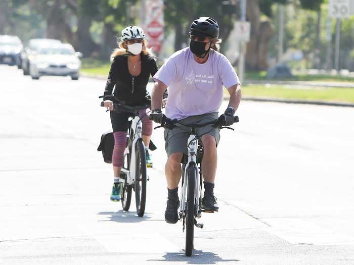 Hollywood golden couple Goldie Hawn and Kurt Russell enjoyed a masked bike ride together in Los Angeles.