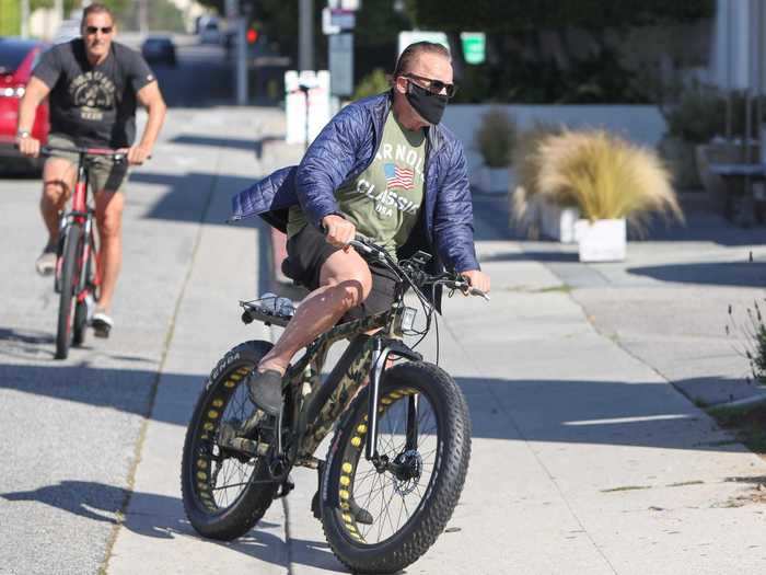 "Terminator" star and former governor of California Arnold Schwarzenegger donned a mask for a bike ride in Los Angeles.