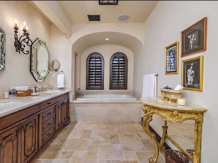 ... and a two-sink bathroom with a windowed tub.