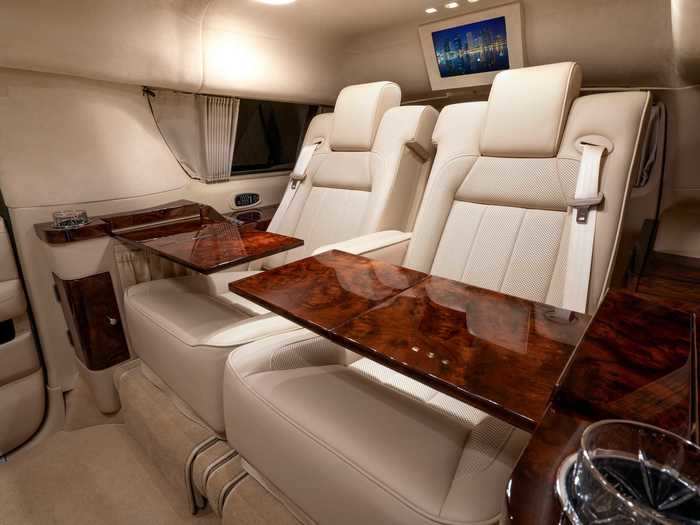 The Italian-leather seats also come with large, airline-style tray tables made from burl wood.