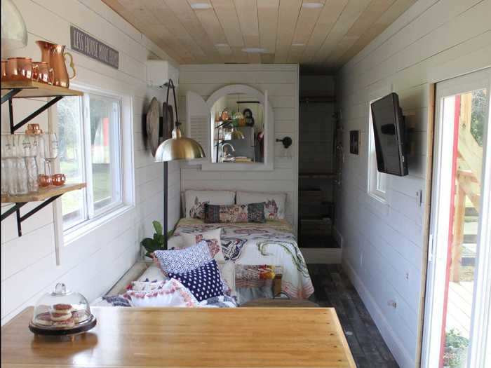 The 40-foot home has a kitchen, living room, bedroom, bathroom, and walk-in closet. While the kitchen is sectioned off by the island, the living room and bedroom are essentially connected.