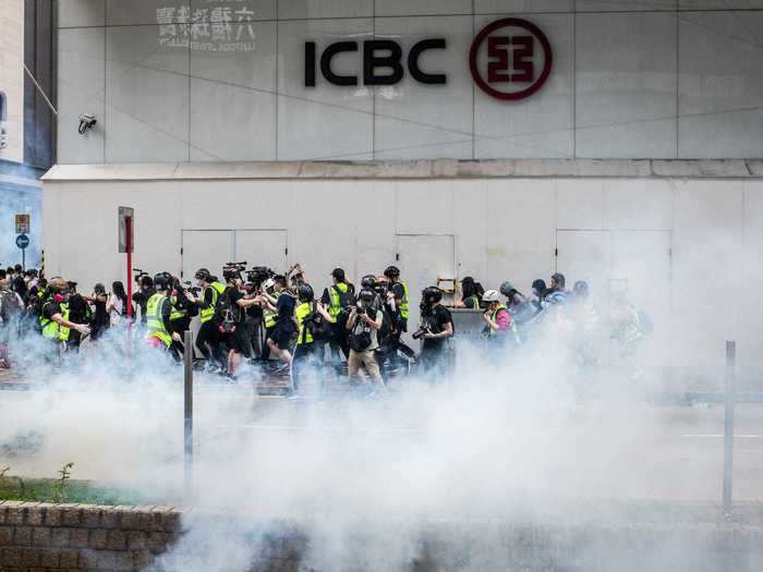 Police stood guard throughout the streets, and less than an hour into the protests they began firing tear gas to disperse crowds.