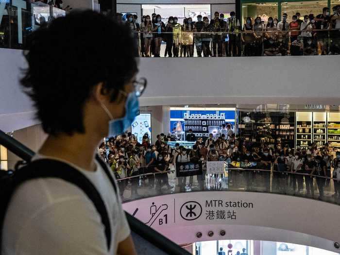 Inside shopping malls, protesters gathered holding signs and chanting pro-democracy slogans.