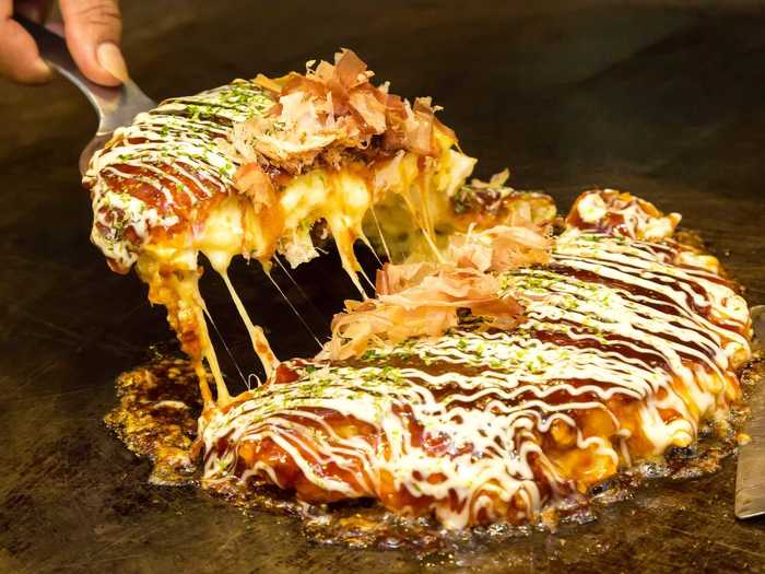 Okonomiyaki is a savory Japanese pancake that you can enjoy at any time, especially if you don