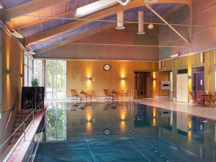 The village bathhouse features a 50-foot pool, two fire-heated hot tubs ...