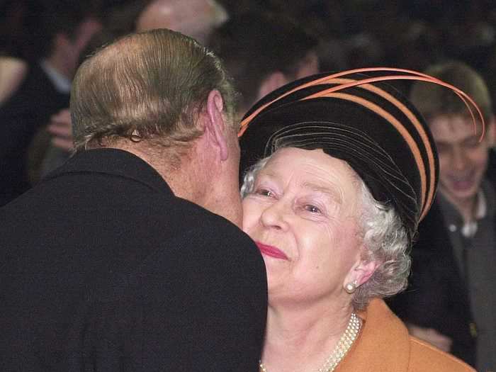 Philip planted a rare kiss on the monarch