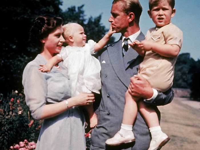 Soon, their family started to grow. Here they are with Prince Charles, right, and Princess Anne, left, in 1951.