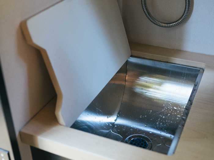 … with a covered sink and space for the portable cooktop and water storage.