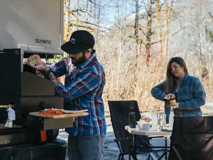 The optional dual burner cooktop and 75-liter fridge and freezer can also be moved to the exterior of the Olympic for outdoor cooking.