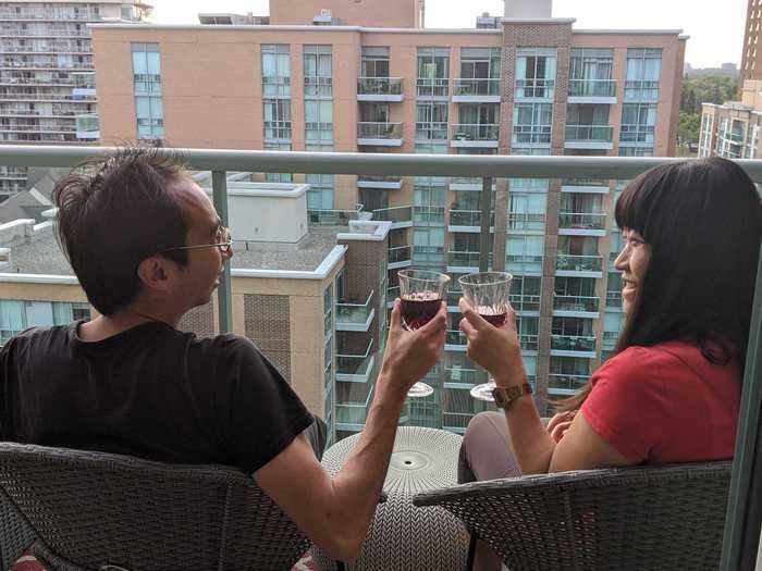 At 5 p.m., they relax with a nice glass of wine on their condo balcony.