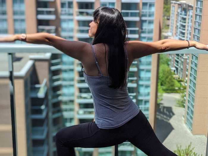 Shen follows up meditation with yoga on her condo balcony half an hour later.